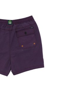 Purple cotton shorts with an elastic waistband, a back pocket featuring a button closure, and orange accents on the pocket.