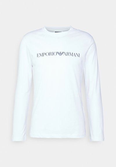 Langermet hvit bomull T-skjorte med en marineblå "Emporio Armani" logo over brystet og rund hals.