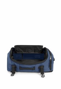 Blauwe sporttas met zwarte accenten, met ritsopening en zijhandvatten. Het interieur is ruim en ongestructureerd, met twee opbergvakken.