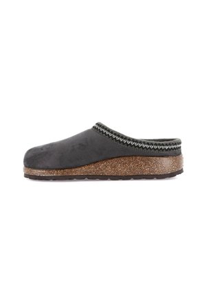Zoccolo in suede nero con un sottopiede in sughero testurizzato, caratterizzato da un elegante bordo decorativo intrecciato grigio e bianco attorno al bordo superiore.