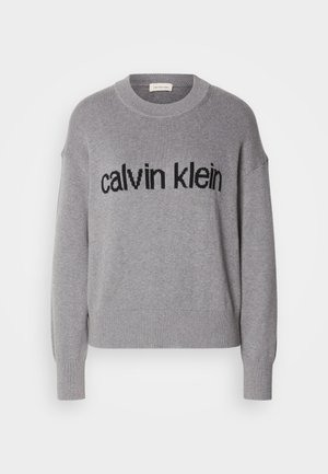 Hall kaelusega hall autoripusa. Ees on must "calvin klein" logo tekst ja soonikkoes varrukaservad ning allserv.