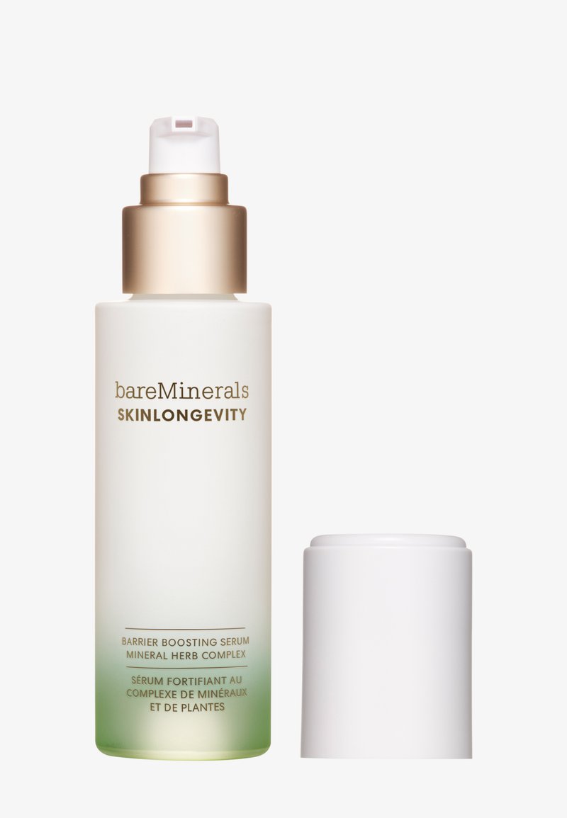 Siero Barrier Boosting Skinlongevity di BareMinerals in un flacone bianco opaco con un tappo dorato, caratterizzato da una gradazione di verde alla base; includere un erogatore bianco.