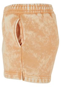 Ferskenfargede tie-dye shorts med elastisk midje og sidelomme. Mykt stoff, tettsittende form og sydd kantdetalj.