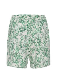 Shorts blancs avec une taille élastique, présentant un motif floral vert petit en all-over.