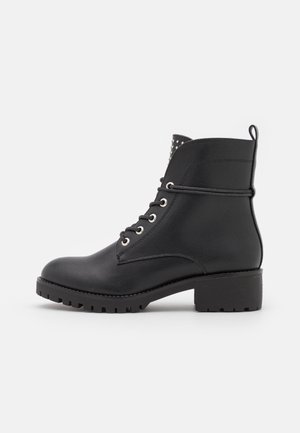 Bottines à lacets - black