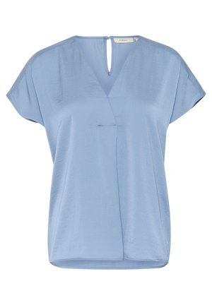 Blouse bleu clair avec un décolleté en V profond, des manches courtes à empiècement, et une finition légèrement texturée. Présente une ouverture en forme de trou de serrure à l'arrière.
