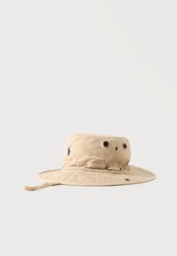 Sélectionné, costal beige