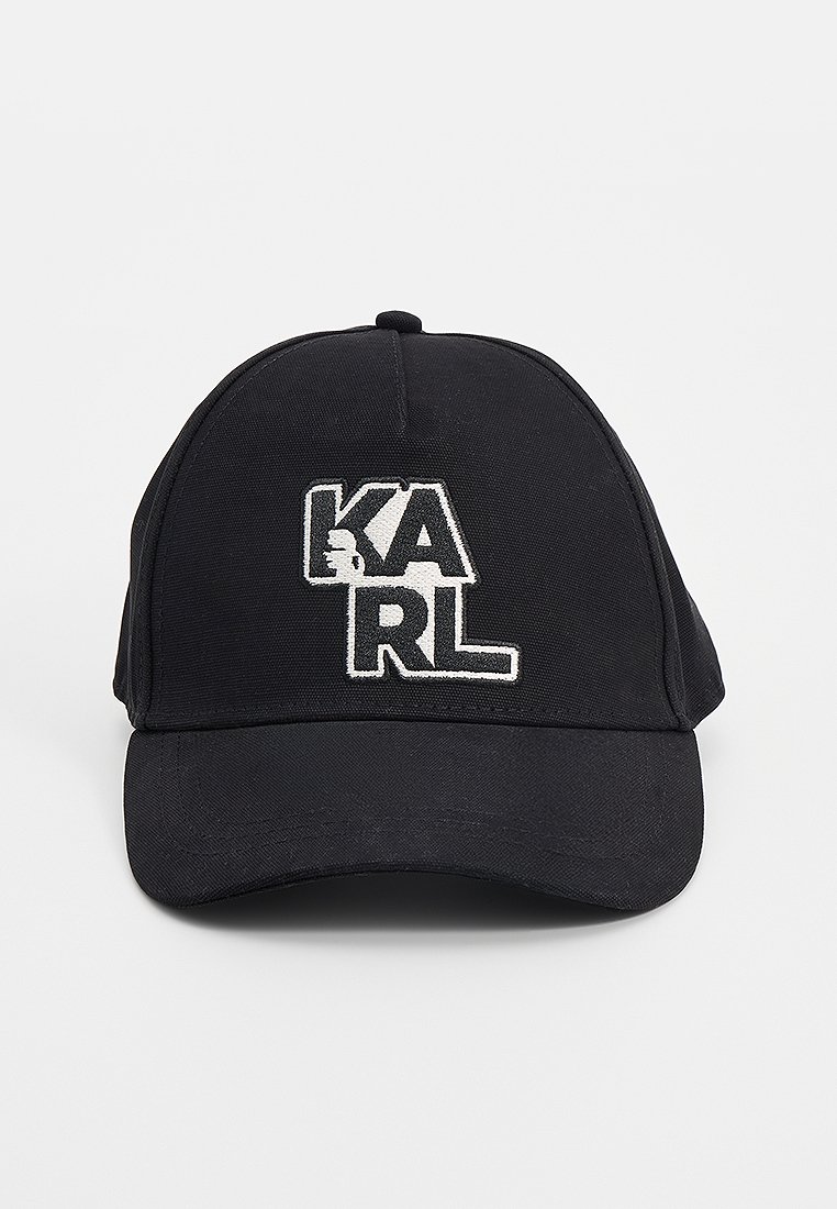 Casquette de baseball noire en coton avec une visière incurvée, ornée d'un logo brodé blanc "KARL" à l'avant. Design structuré, sans motifs.