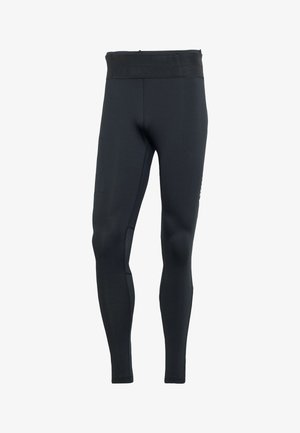 Schwarze Leggings aus dehnbarem Material mit hohem Bund, ausgestattet mit einem strukturierten Mesh-Einsatz an den Seiten und einer engen Passform.