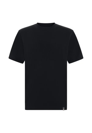 T-shirt noir uni à manches courtes avec col rond, doté d'une petite étiquette logo rectangulaire en bas de l'ourlet, sur fond blanc.