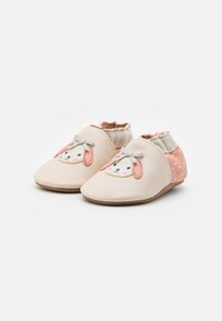 Vaaleanbeiget nahkakengät vauvoille, joissa on vaaleanpunainen eläinkasvokuvio, harmaa rusetti, joustavat suunapitimet ja kuviollinen vaaleanpunainen kanta.