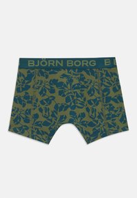 Olíva zöld boxer short virágos mintával sötét teál színben. Márkázott derékpántja és kontrasztos varrás részletei vannak.