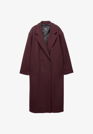Burgundowa wełniana kurtka o podwójnym zapięciu, szerokimi klapami i dwoma przednimi kieszeniami. Gładka tekstura i luźny krój.