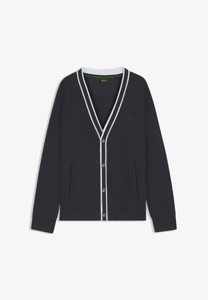 Granatowy kardigan z miękkiej bawełny z białymi akcentami, dekolt w serek, zapięcie na guziki, dwie przednie kieszenie oraz ściągacze przy mankietach i na dole.