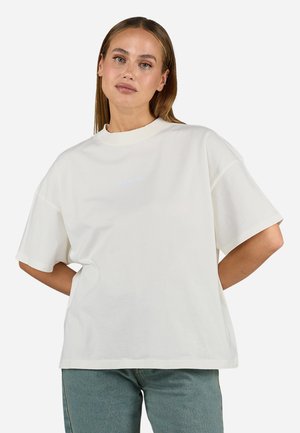 T-shirt surdimensionné crème en coton, avec un col rond et des manches courtes. Logo "Pegador" en bleu clair à l'avant.