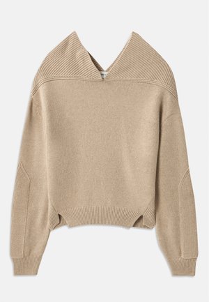 Beige knitted sweater featuring a deep V-neck, ribbed texture on the shoulders and cuffs, and a cropped hem with side slits.