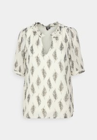 Blouse à manches courtes de couleur crème avec un motif de plumes grises. Présente un col à volants et une ouverture en forme de goutte d'eau à l'avant. Tissu léger.