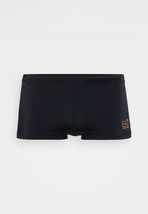 Juodi maudymosi šortai, pagaminti iš lygaus audinio. Turi žemą liemenį, trumpą kojų ilgį ir mažą auksinį logotipą šone. Paprastas dizainas.