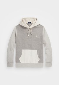 Huvtröja med grå kropp, krämfärdade detaljer, framfickor och justerbara dragsnören. Tillverkad av mjukt, texturerat tyg.