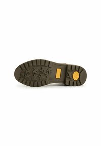 Sole of a boot in gray rubber with a deep tread pattern. Features a yellow circular accent and branding in orange rectangular box.