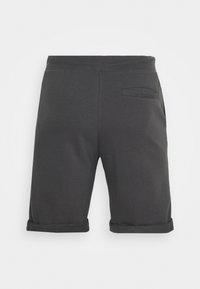 Svarte bomullsshorts med rullet hem, med en baklomme og glatt tekstur. Enkelt design, midt p�å låret lengde.