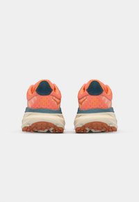 Trail running shoes with bright coral and orange mesh upper, blue accents, and beige sole featuring a textured outsole for grip.