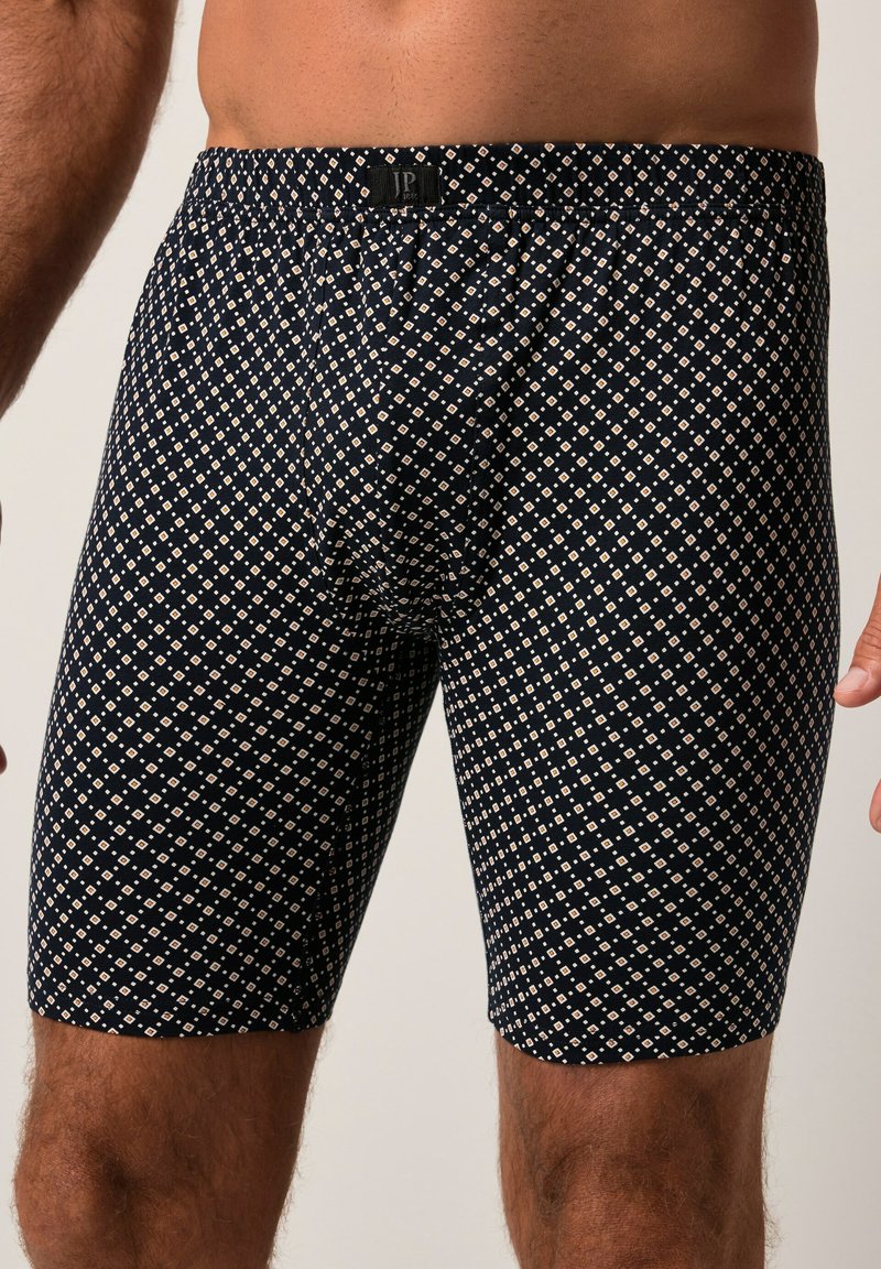 Boxer briefs blu navy con motivo a diamante color crema, realizzati in tessuto elasticizzato con vita elastica per un comfort ottimale.
