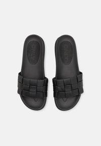 Black slide sandals with a woven strap design and a smooth, matte finish. Features a flat sole and a cushioned footbed for comfort.