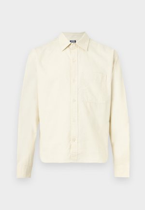 Long-sleeve cream shirt with a collar, front buttons, and a single chest pocket, displayed against a light background.