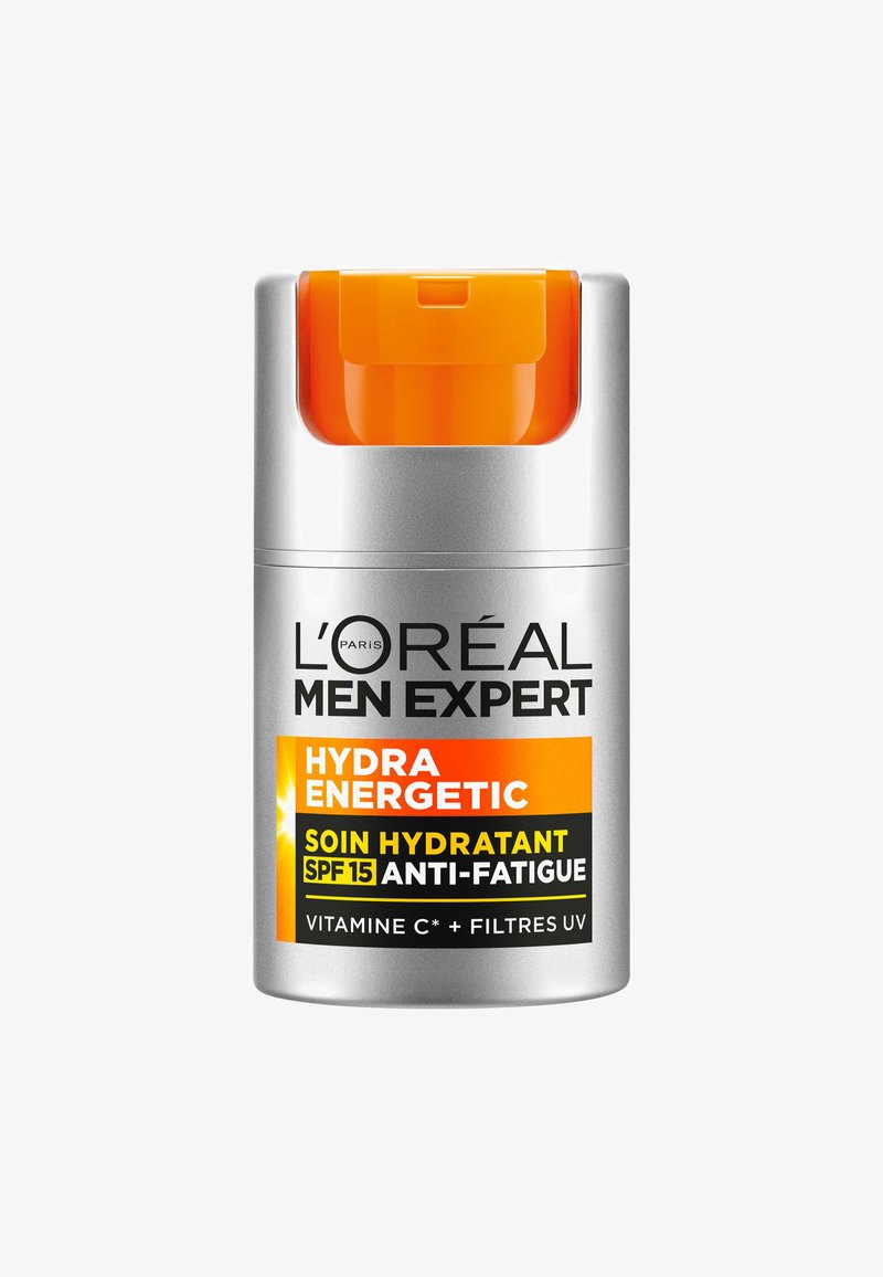 Hydratant L'Oréal Men Expert Hydra Energetic dans un conteneur cylindrique argenté avec un couvercle orange à pression, étiqueté SPF 15, anti-fatigue.