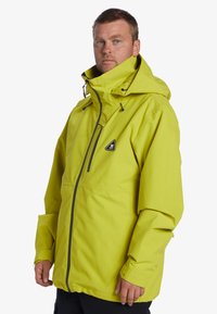 Yellow waterproof jacket, hooded, with a front zipper, adjustable drawstrings, and a triangular logo on upper left chest. Smooth texture.