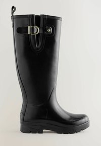 Must have musta kummisaapad sujuva tekstuuriga, ümar varvas, kõrge kvaliteediga logo, reguleeritav rihm kuldse pandlaga ning tekstuuriga talla jaoks, et tagada paremat haarduvust.