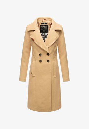 Beige dobbeltspent kåpe med store sorte knapper, snippkrage, sidelommer og et intrikat mønsterfôr.