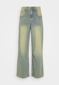 High-waisted wide-leg jeans with faded yellow patches on light blue denim and classic five-pocket design.