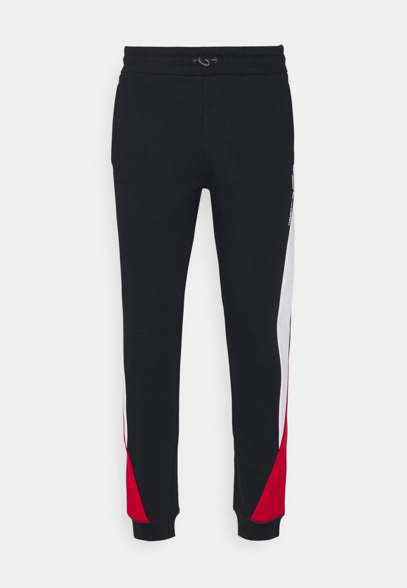 Schwarze Sweatpants mit elastischem Bund und seitlichen roten und weißen Panels. Hergestellt aus weichem Material mit gerippten Bündchen.