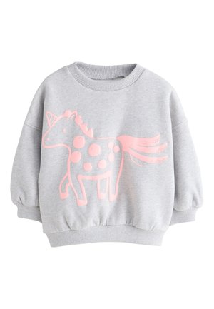Sudadera gris claro de manga larga con puños y bajo de canalé, con un gran unicornio rosa de dibujos animados con manchas en el frente.