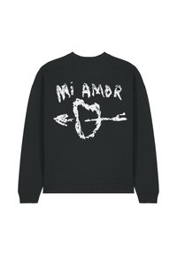 Felpa nera con testo "Mi Amor" in bianco, con un design di cuore e freccia. Materiale in misto cotone, polsini e orlo a coste.