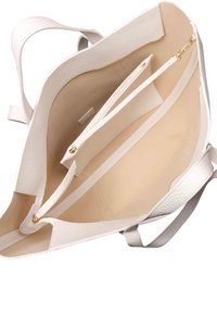 White synthetic tote bag with a textured finish, featuring a spacious interior and two zippered pockets. Smooth fabric lining.