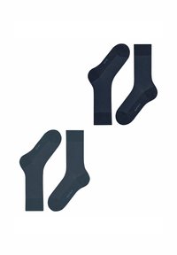 Dunkelblaue Socken mit einem strukturierten Muster im Fußbereich, glattem Schaft und verstärkten Fersen. Branding an der Seite sichtbar.