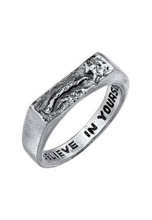 Silver ring with a textured, irregular surface and engraved message "BELIEVE IN YOURSELF" along the interior. Rectangular shape.