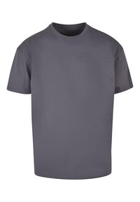 Grå crew neck t-skjorte laget av myk bomull, med korte ermer og en løs passform. Minimalistisk design uten mønstre eller dekorer.