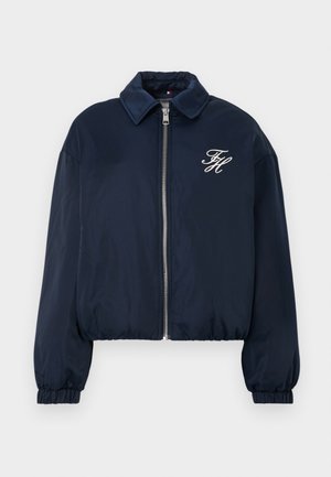 Navy blue zip-up jacket with elastic cuffs, collar, and white embroidered initials "FH" on the left chest.