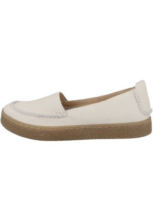 Chaussure décontractée à enfiler avec tige en cuir blanc, détails cousus et semelle épaisse en caoutchouc brun clair texturé.
