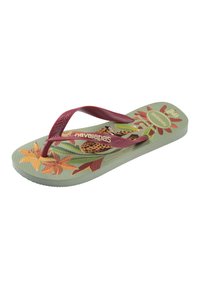 Infradito con cinturini rossi, design tropicale con fiori e uccelli sulla suola verde chiaro, con marchio "havaianas" sul cinturino e sulla suola.