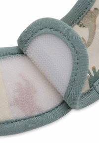 Sangle en tissu doux avec une bordure vert menthe, dotée d'une fermeture Velcro et d'une couche intérieure imprimée représentant de petits animaux.