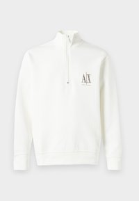 Vit zippered sweatshirt i mjukt material. Har en liten logotyp på vänster bröst i brunt samt ribbad avslutning runt ärmar och nederkant.