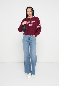 Tommy Jeans CLAIRE - Wide leg - denim medium