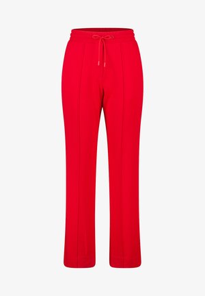 Pantalons de survêtement rouges avec taille à cordon, dotés de poches latérales et de coutures verticales. Fabriqués en tissu doux et extensible pour le confort.