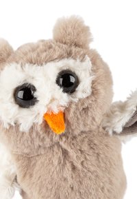Stuffed owl toy with soft beige and white fur, large black plastic eyes, an orange beak, and small round ears. Arms raised slightly.