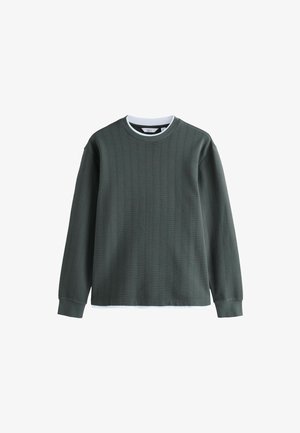 Mørkegrøn ribbede sweatshirt med lange ærmer, rund halsudskæring og kontrastfarvet hvid inderskalskrave. Har et tekstureret stofdesign.